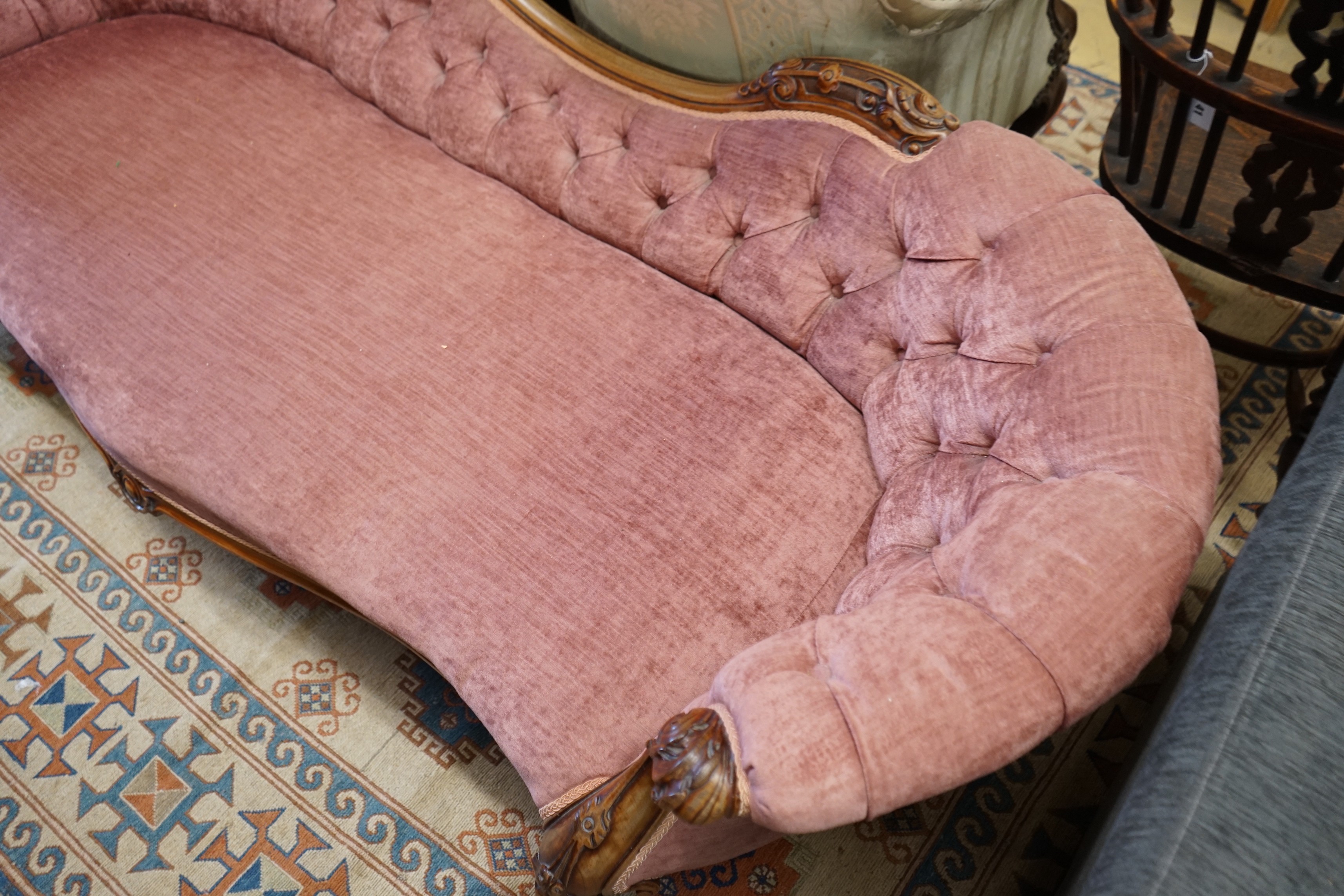 A Victorian faded rosewood chaise longue upholstered in buttoned pink dralon, length 190cm, width 80cm, height 88cm